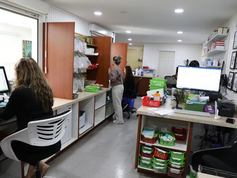 Pharmacy staff at Pharmacie 1 — Anaheim processing prescriptions